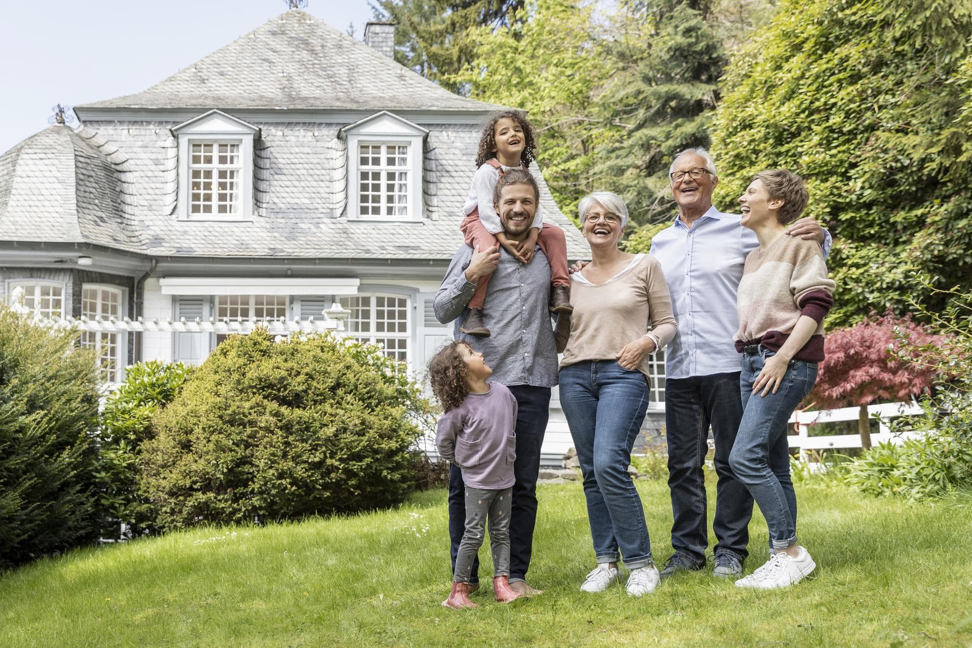 A multi-generational Ohio family outside their home, the legacy Costaras Law helps protect
